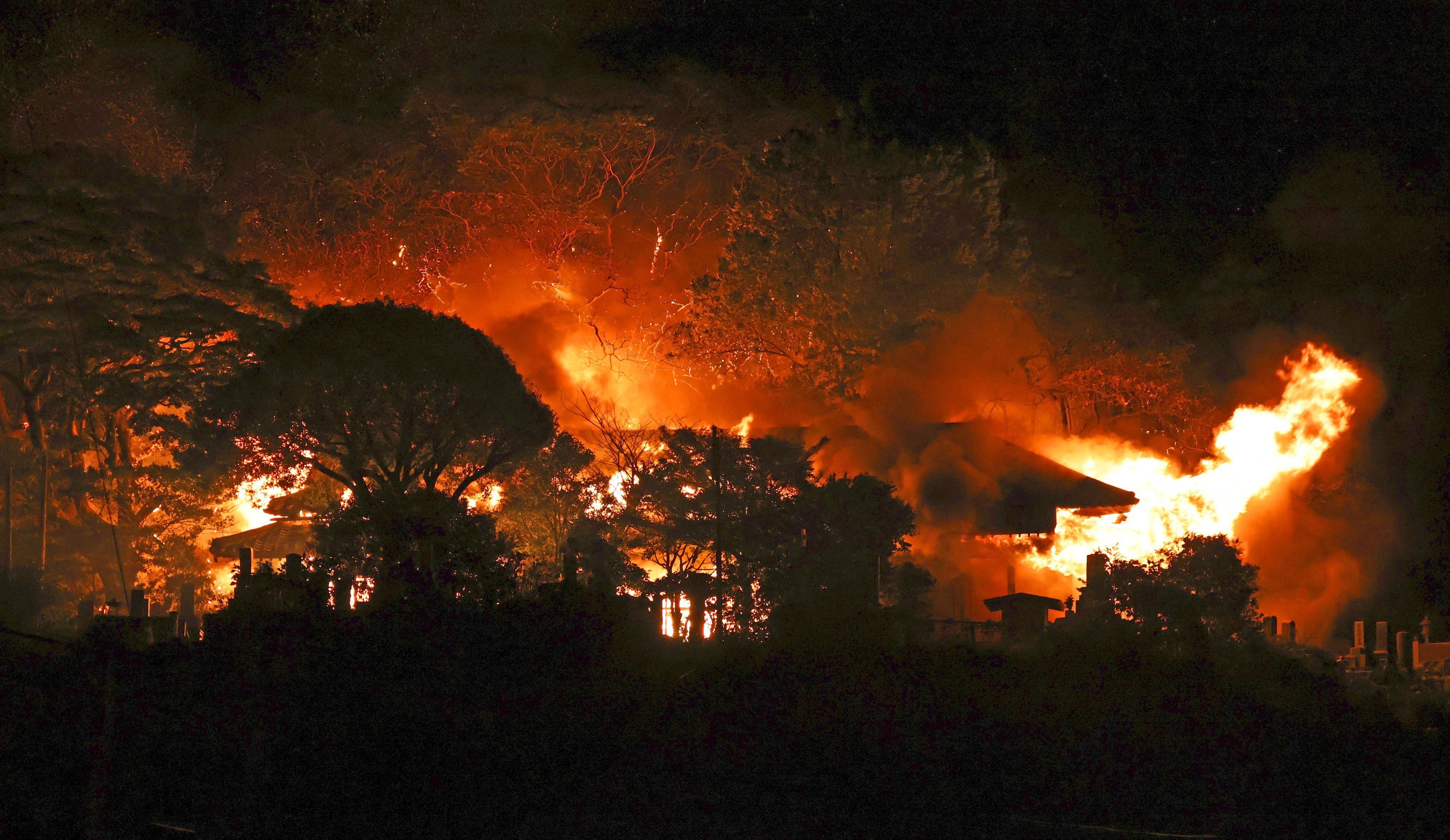 Smoke rises over buildings after a fire in Oita, southern Japan, Wednesday.